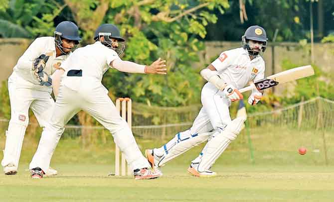 Sri Lanka-s Niroshan Dickwella plays a shot during a warm-up match against Board President-s XI in Kolkata on Saturday. Pic/PTI