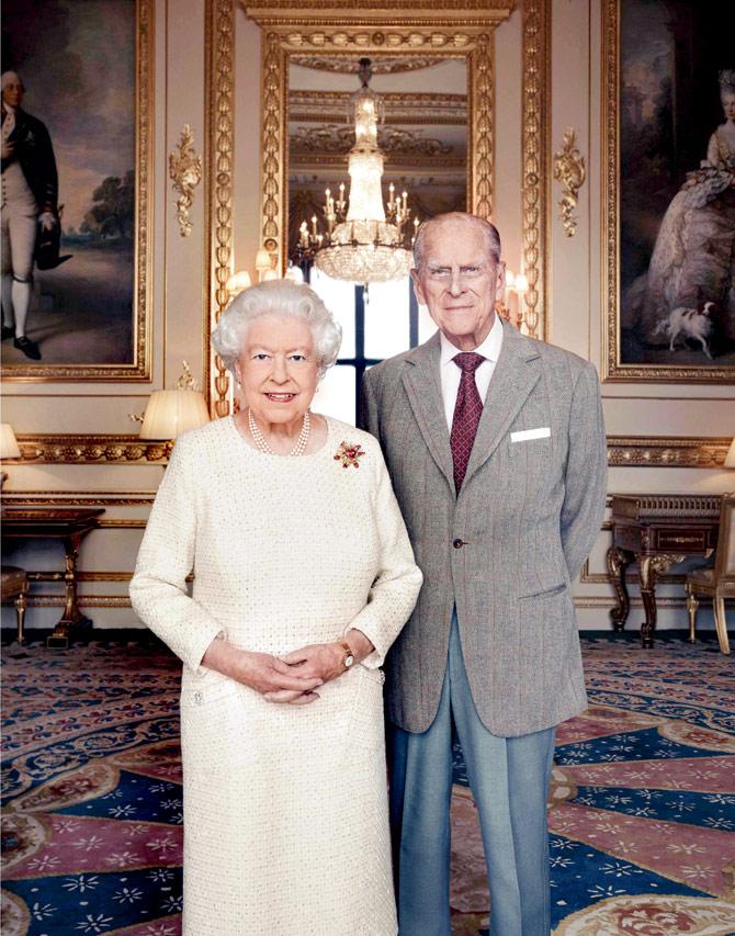 Britains Queen Elizabeth II and her husband, Prince Philip, Duke of Edinburgh, pose to mark their platinum wedding anniversary. PIC/AFP