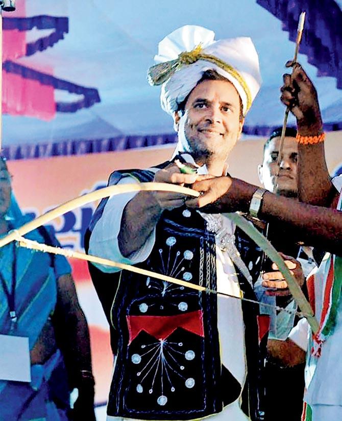 Rahul Gandhi wears a traditional dress during an election campaign in Dahod. PICS/PTI