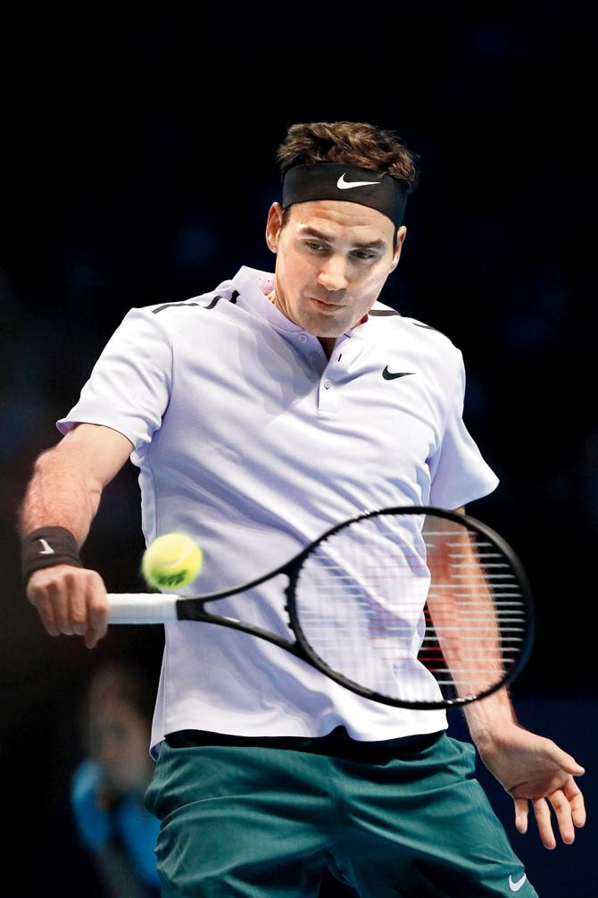 Roger Federer returns to Jack Sock yesterday. Pic/AFP