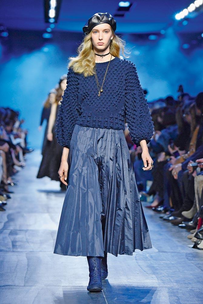 Pick a pleated skirt (metallic for your evening out) to pair with a long or a short jumper, at seen on Christian Dior