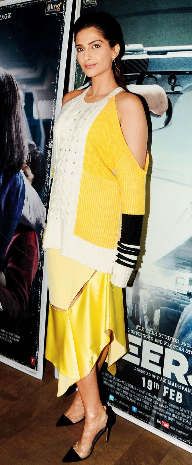 Sonam Kapoor in a bulky sweater over a dainty dress by Prabal Gurung. Pic/AFP