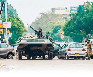 Military takes control of Zimbabwe, President Robert Mugabe under house arrest