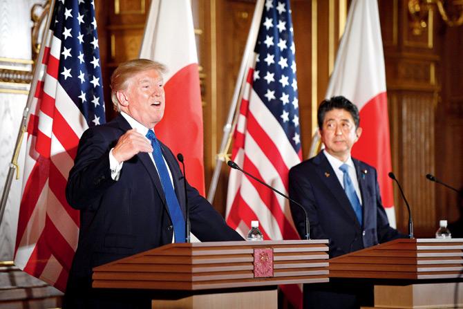 Donald Trump and Japanese Prime Minister Shinzo Abe (R) attend a joint press conference at Akasaka Palace in Tokyo on Monday. Pic/AFP