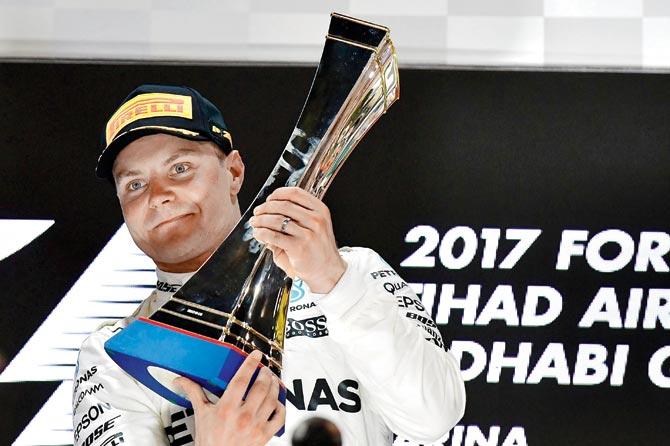 Valtteri Bottas celebrates on the podium yesterday. Pic/AFP