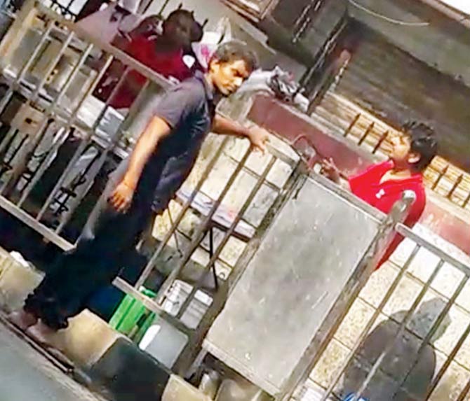 The video shows the worker, Vijay Gauda, sawing off the railing