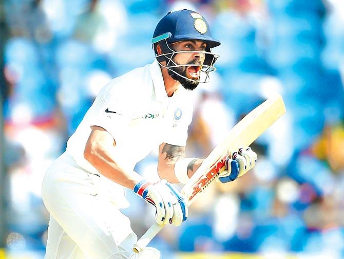 India skipper Virat Kohli reacts while batting on the third day of the second Test against Sri Lanka at the Vidarbha Cricket Association Stadium in Nagpur yesterday. Kohli ended up scoring 213. Pic/AFP