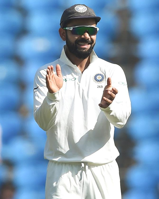 Indian cricket team captain Virat Kohli gestures during the fourth day of the second Test cricket match between India and Sri Lanka at the Vidarbha Cricket Association Stadium in Nagpur on November 27, 2017. Pic/AFP