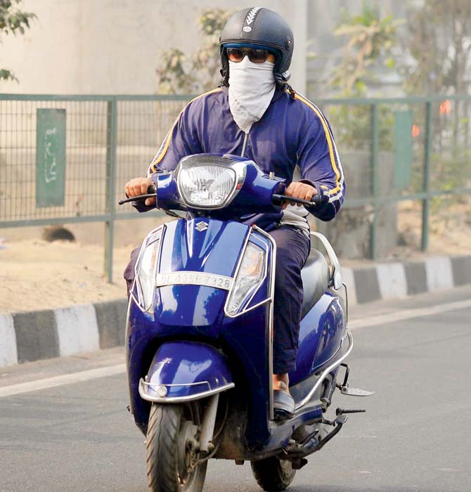 The government has exempt women drivers and two-wheelers from the odd-even rationing. Pic/PTI