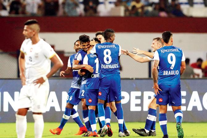 Bengaluru FC players are ecstatic after a goal against Mumbai City FC in an Indian Super League Season match yesterday. Pic/Sportzpics