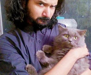 Now, cat-loving men are openly flaunting their love for felines on social media