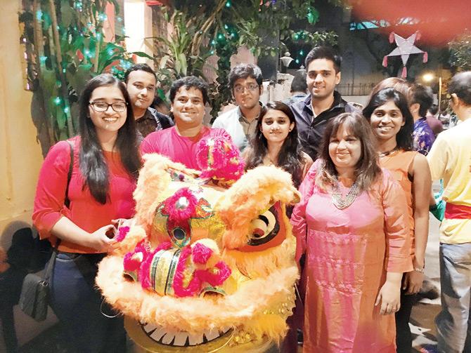 Students of the institute celebrating Chinese New Year with a Chinese  family from Mumbai