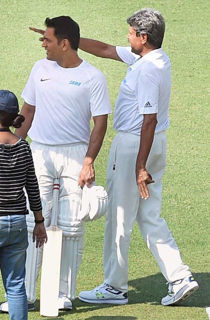 Cricket legend Kapil Dev with cricketer MS Dhoni. Pics/PTI