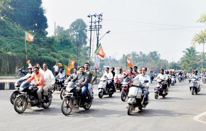 Bhartiya Janta Party (BJP) members held a motorbike rally during a day-long strike in Agartala yesterday to protest the killing. Pic/PTI