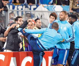 UEFA hands Marseille defender Patrice Evra one-match ban for kicking a fan