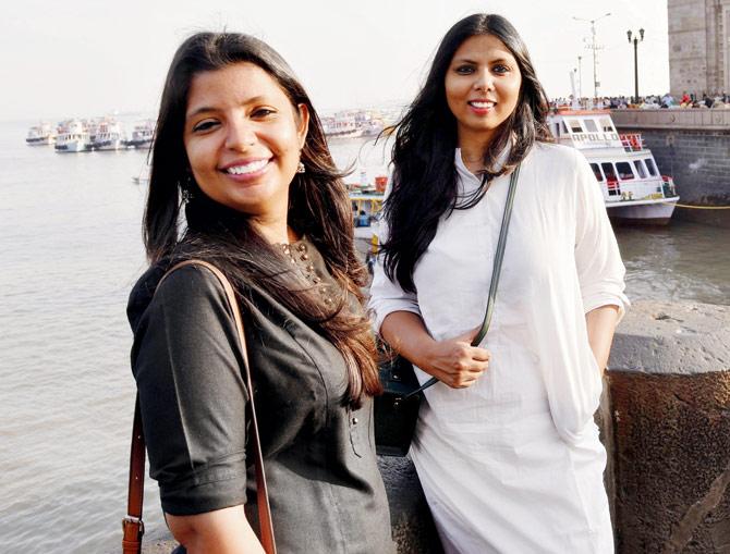 Ritu Sinha and Divya Saxena flanked by  the yachts at The Gateway of India. Pic/Pradeep Dhivar
