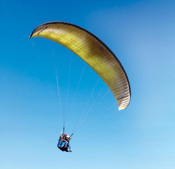 Travellers can enjoy paragliding sessions in Kamshet. Pic courtesy/Bat Travels