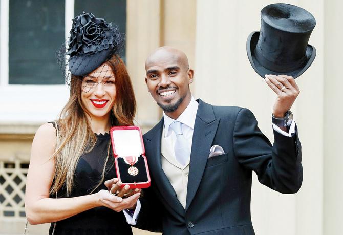 British athlete Mo Farah with his wife Tania after he was knighted at the Buckingham Palace in London yesterday. Pic/AFP