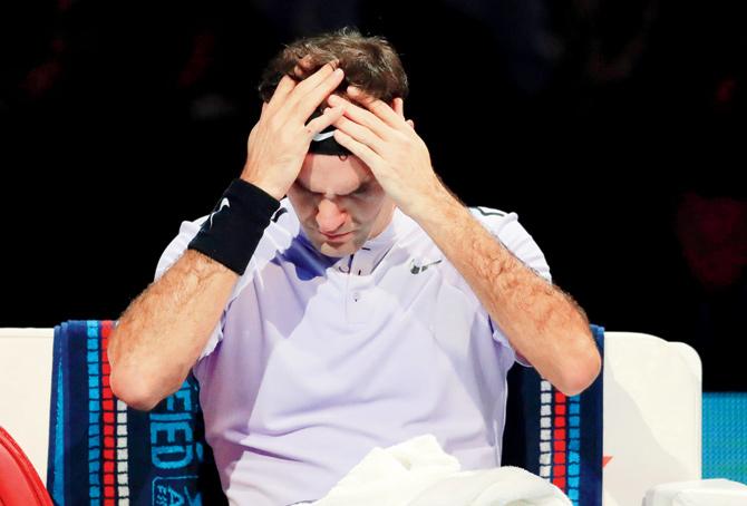 Roger Federer reacts after losing the second set to David Goffin in the semi-finals of the ATP World Tour Finals on Saturday. Pic/Getty Images