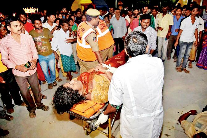 An injured person being taken to hospital after the overloaded boat carrying 38 people capsized. PIC/PTI 