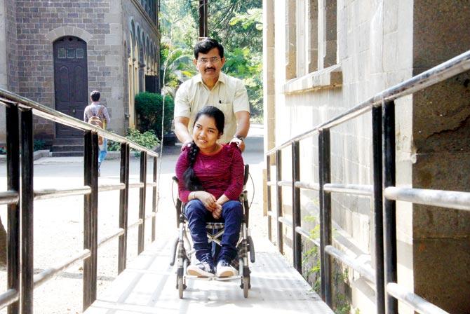 Tanvi Doke is wheeled into Fergusson College by father Dinesh Doke, who is Additional CEO at the Pune Zilla Parishad. Pic/mandar tannu
