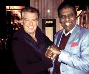 Vijay Amritraj meets Pierce Brosnan in London. See photo