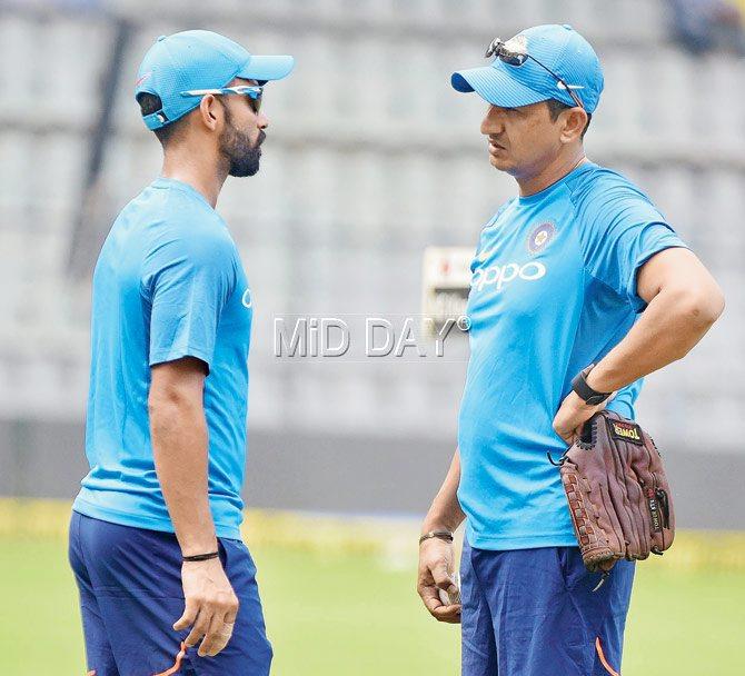 Ajinkya Rahane chats with Team India batting coach Sanjay Bangar at the Wankhede Stadium on Saturday. Pic/Suresh Karkera