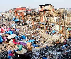 Day after slum fire near Bandra station, BMC douses demolition drive