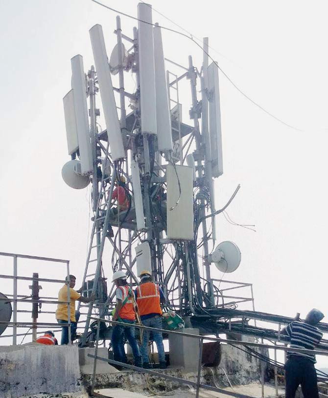 The mobile towers are being pulled down from the rooftop of Daseshwar apartments after a three-year battle