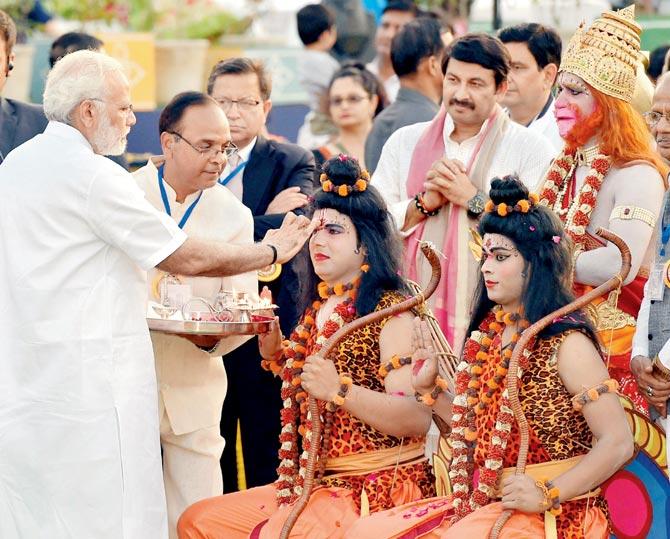 PM Modi performs tilak of artists enacting Lord Rama and Lakshman during Dussehra celebrations at Parade Ground in New Delhi