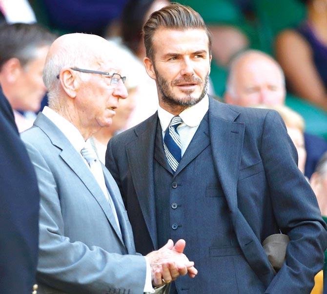 David Beckham with Bobby Charlton. Pic/Getty Images