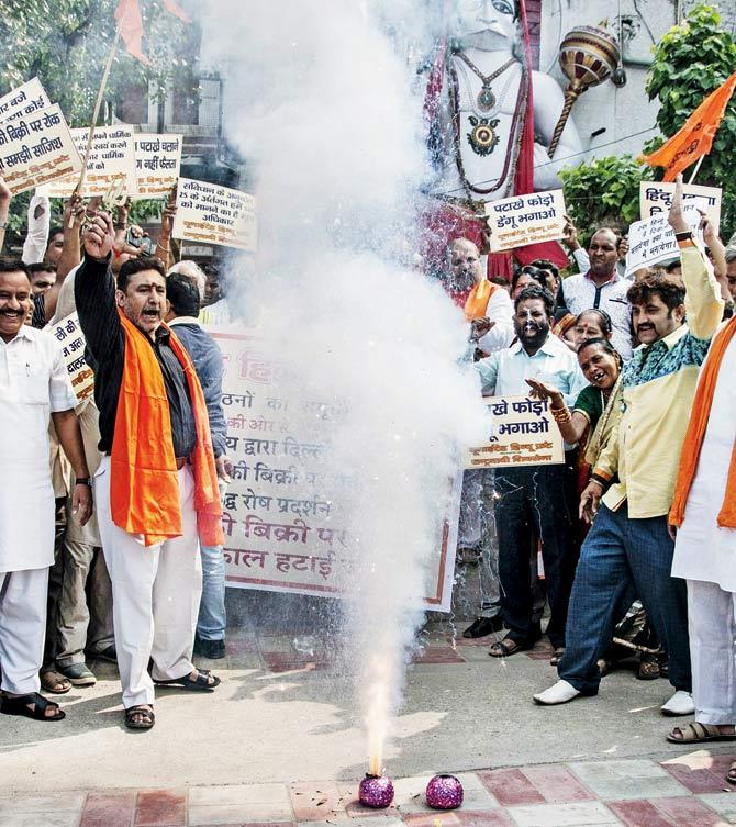 Protesters set off firecrackers in New Delhi on Friday to express their opposition to the Supreme Court