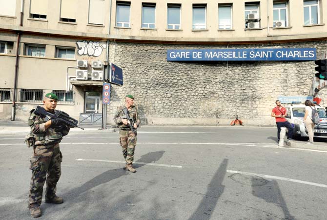 French soldiers patrol outside the Marseille railway station. Pic/AFP