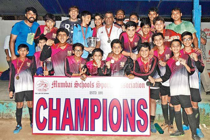 The victorious DY Patil team with their U-14 Division II trophy yesterday, coach Hanzel (encircled). Pic/Suresh Karkera