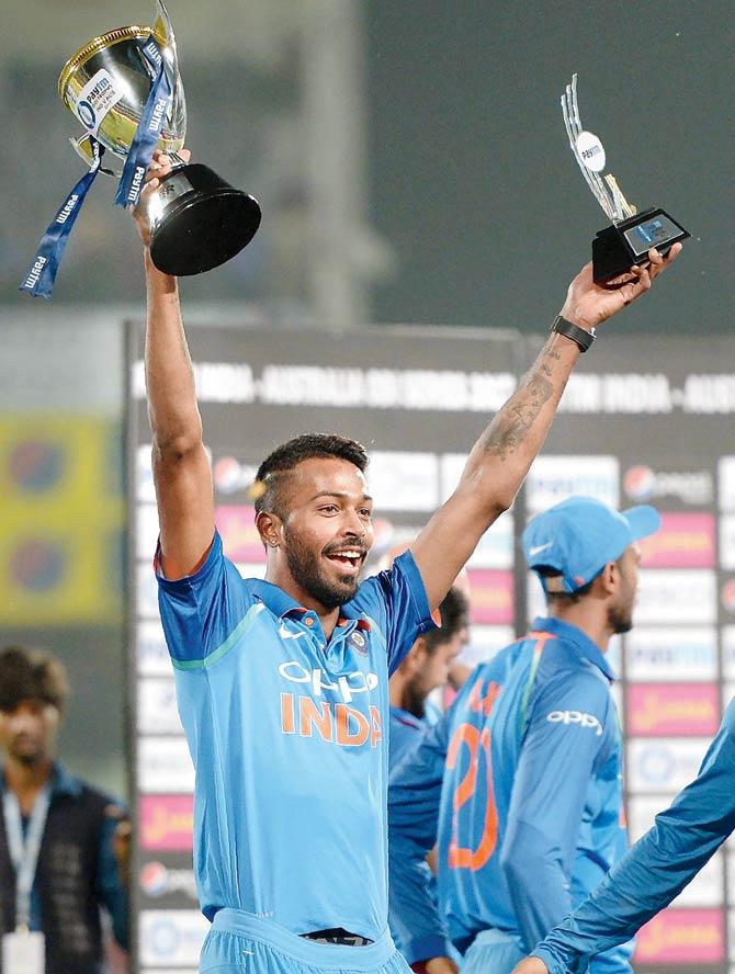 Man of the series Hardik Pandya holds two trophies after India