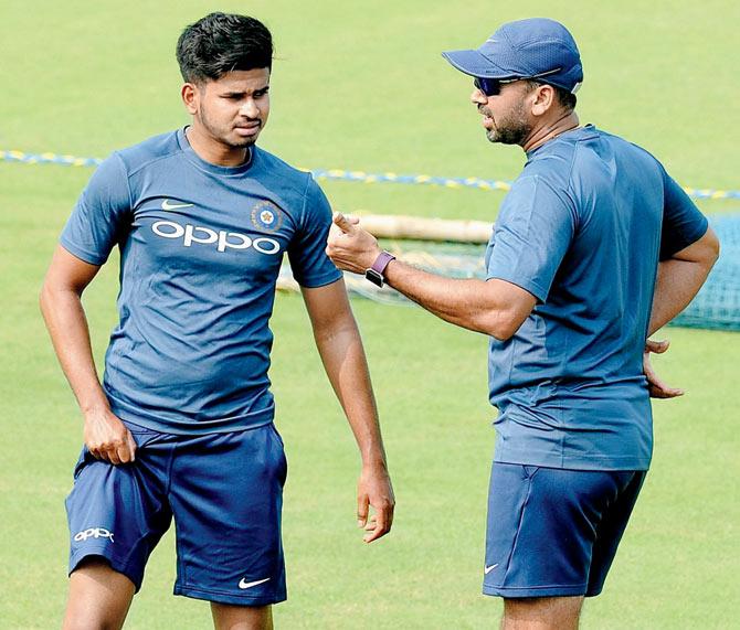 Shreyas Iyer (left) receives tips from India 