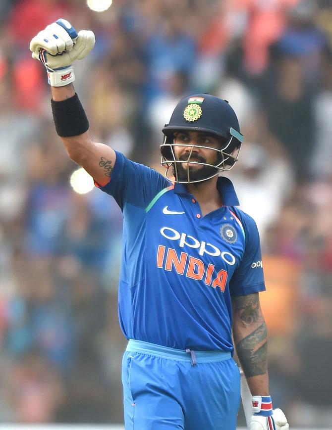 Indian team captain Virat Kohli celebrates after scoring a century (100 runs) during the first one-day international cricket match between India and New Zealand at the Wankhede stadium in Mumbai on October 22, 2017. Pic/AFP