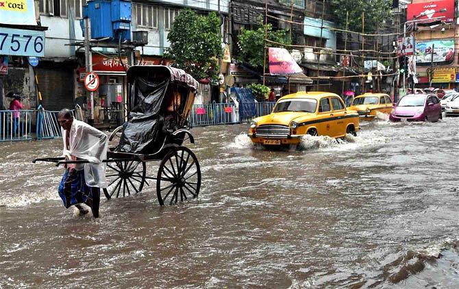 A road flooded with rain waters in Kolkata on Monday. Photo/PTI