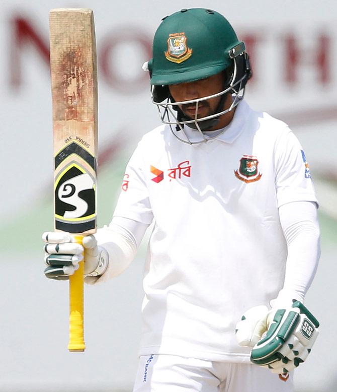 Bangladesh batsman Mominul Haque raises his bat as he celebrates scoring a half century (50 runs) during the third day of the first Test cricket match between South Africa and Bangladesh in Potchefstroom on September 30, 2017. Pic/AFP