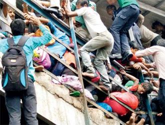 Mumbai stampede: Day later, flowers, candles, cops fill Elphinstone Road station
