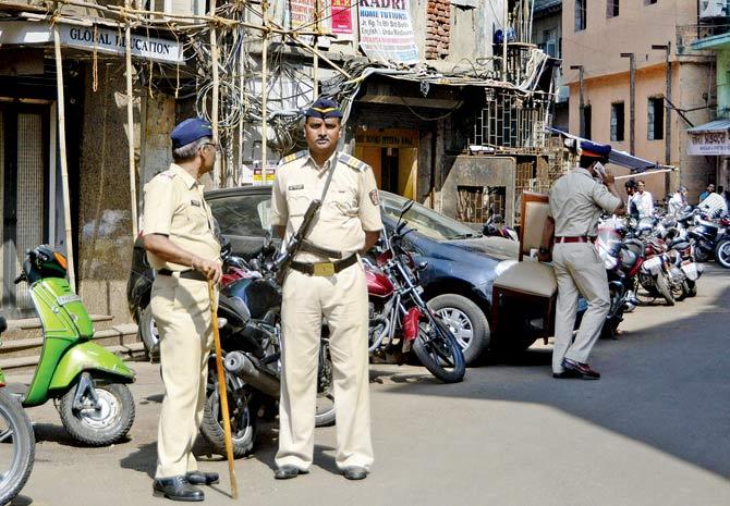 In this photo taken in November 2016, police officers stand outside a property owned by the IRF. File pic