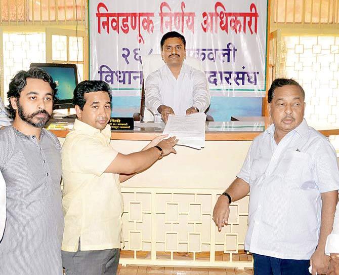 Nitesh (second from left) and Narayan Rane (right)