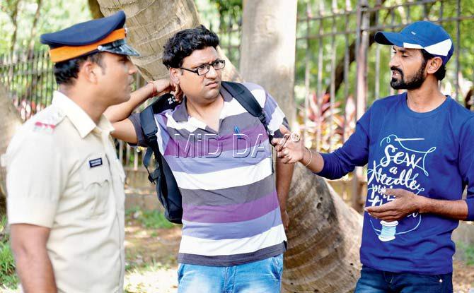 Ravindra Gupta and Harvinder Singh (right) speak to a policeman at the Oval Maidan yesterday