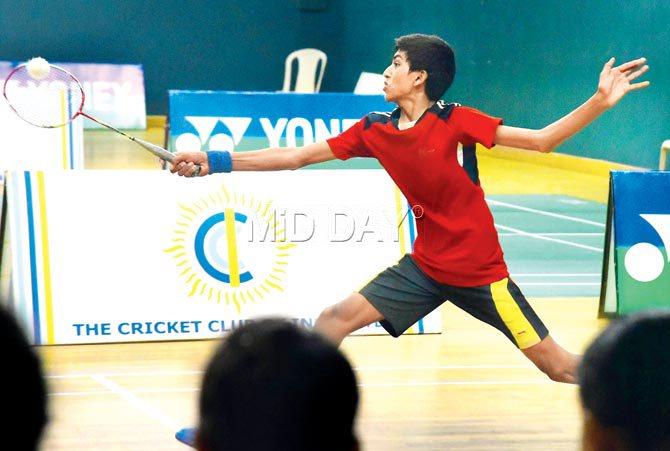 Ruturaj Rathod returns to Aaryavardhan Jadhav during a MSSAâu00c2u0080u00c2u0088U-14 badminton match at CCI yesterday. Pic/Atul Kamble