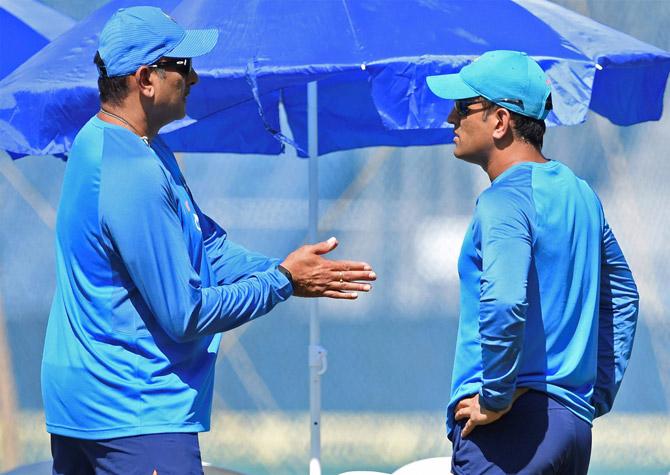 MS Dhoni with the team coach Ravi Shastri during a practice session ahead of the 2nd ODI cricket match against New Zealand, in Pune on Tuesday. Pic/PTI