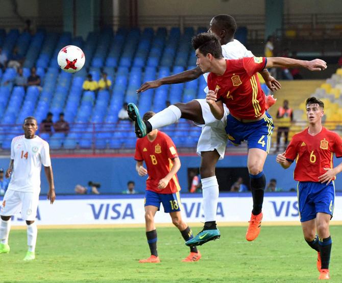 Players of Niger (white jersey) and Spain vie for the ball during their U-17 FIFA World Cup football match in Jawaharlal Nehru International Stadium Kochi on Tuesday. Pic/PTI
