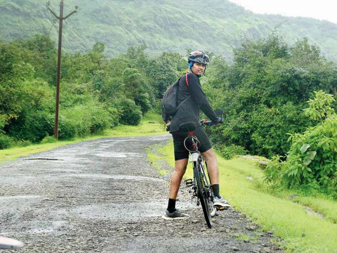A cyclist on a track in Tamhini Ghat