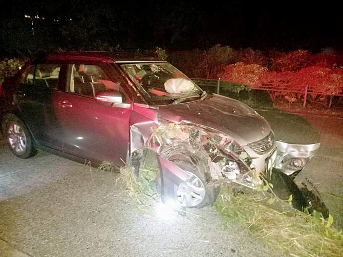 When an unidentified vehicle hit the car on the Mumbai-Pune Expressway, it dashed into the divider and landed in the bushes next to the road