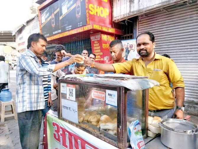 Mangesh Ahivale selling vada pav at his stall