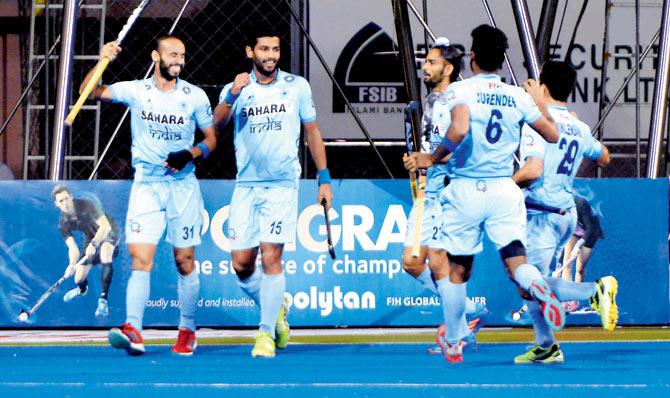 Indian players celebrate a goal against Malaysia in the Asia Cup final at the Maulana Bhashani National hockey stadium in Dhaka yesterday